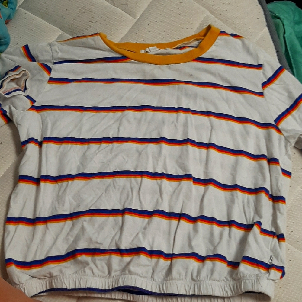 the white stripped shirt is purple blue,yellow,red